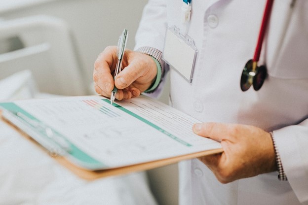 Doctor Writing — Overland Park, KS — Wiesner & Frackowiak LC